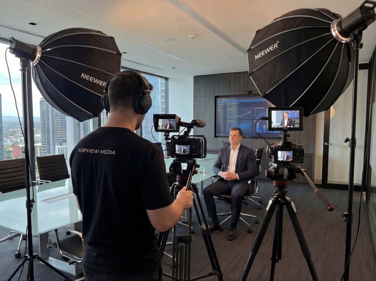 Event videographer on the Gold Coast filming a corporate event with professional camera gear